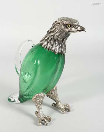 A VERY GOOD EAGLE CLARET JUG, with glass body, plated head with glass eyes and plated feet. 10ins