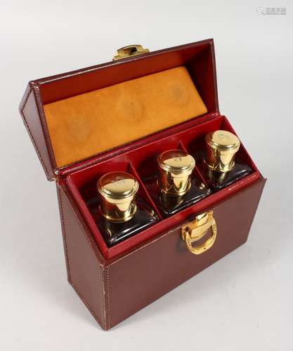 GUSTAVE KELLER, PARIS A TRAVELLING LEATHER VANITY CASE, with three cut glass scent bottles with