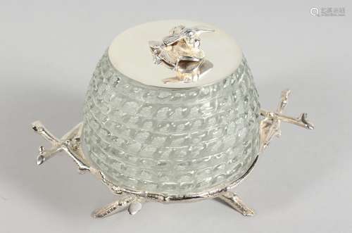 A SILVER-PLATED AND CUT GLASS BEEHIVE HONEY POT ON STAND.