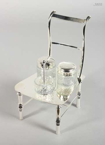 A SILVER-PLATED CHAIR THREE PIECE CRUET SET.