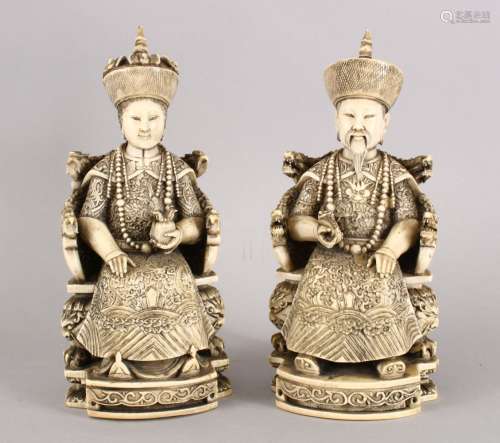 A GOOD PAIR OF 19TH CENTURY CHINESE CARVED IVORY SEATED EMPEROR AND EMPRESS, the figures both