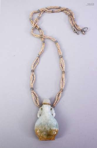 A GOOD CHINESE 19TH / 20TH CENTURY CARVED JADE SNUFF BOTTLE NECKLACE, carved to depict prunus, 5.