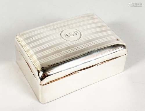 A SILVER CIGARETTE BOX, with engine turned hinged lid. Birmingham 1913. 5ins wide.