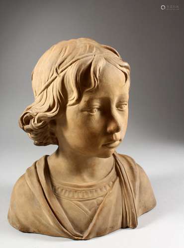 A TERRACOTTA BUST OF AN ITALIAN YOUNG BOY. 12ins high.