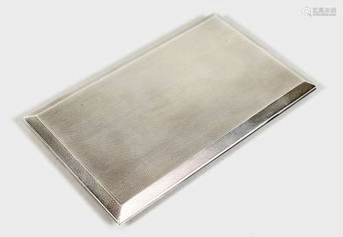 A SILVER CIGARETTE CASE, with engine turned decoration. London 1939. 5.5ins wide.