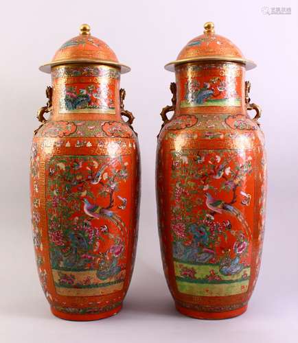 A LARGE PAIR OF CHINESE 19TH CENTURY CORAL RED FAMILLE ROSE PORCELAIN VASES, each vase decorated