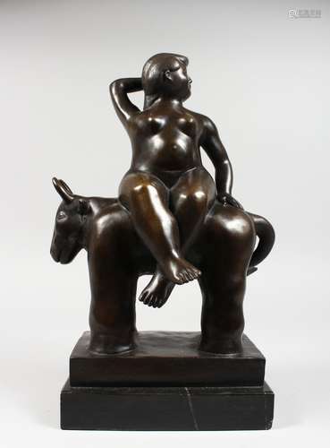 AN ART DECO BRONZE GROUP OF A FAT LADY RIDING A COW, on a marble base. 14ins high.