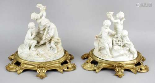 A pair of biscuit porcelain figure groups,