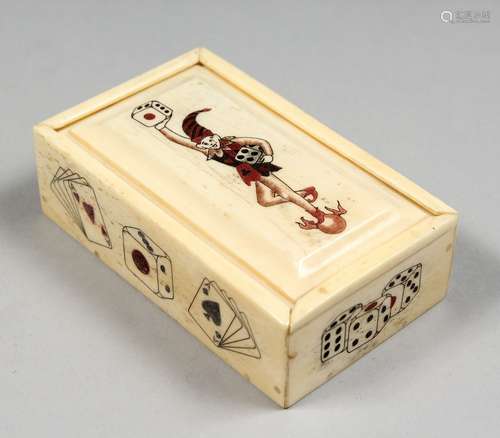 AN ETCHED BONE NOVELTY DICE BOX and DICE. 3.25ins long.