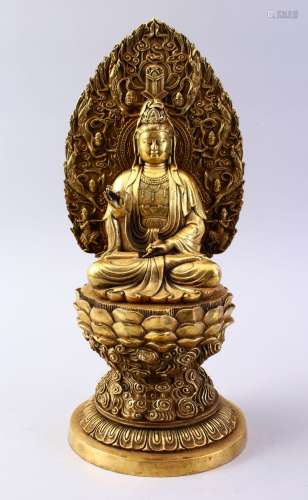 A GOOD CHINESE BRONZE FIGURE OF GUANYIN, seated in a meditating position, upon a lotus base with a