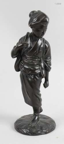 A Japanese bronze figure modelled as a young female in traditional dress,