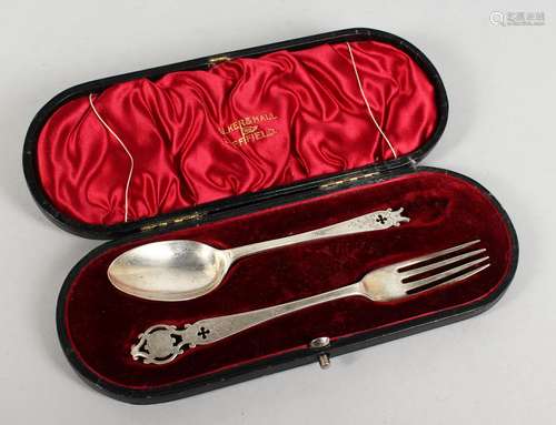 A WALKER & HALL SILVER CHRISTENING SPOON AND FORK in a fitted case. Chester 1906.