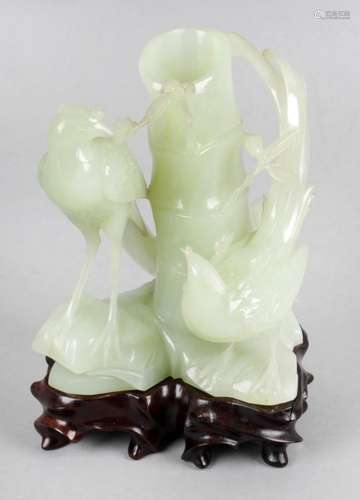 A small collection of carved jadeite to include faux bamboo and bird decorated vase,