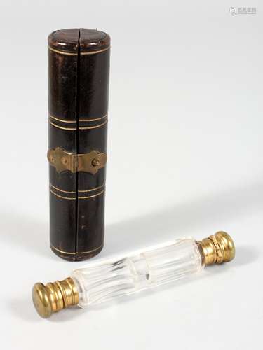 A VICTORIAN DOUBLE ENDED SCENT BOTTLE, in a leather folding case.