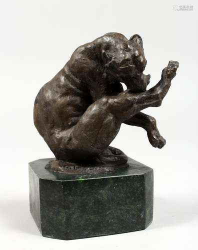 A SMALL BRONZE OF A LION. Signed, on a marble base. 5.5ins high.