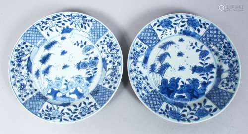 A PAIR OF CHINESE 18TH CENTURY BLUE & WHITE PORCELAIN PLATES, the body decorated with a landscape