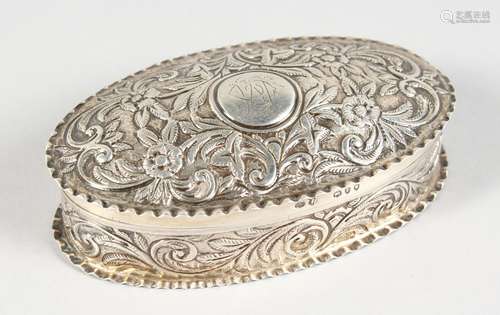 A VICTORIAN OVAL SILVER PIN BOX AND COVER, with repousse decoration. London 1890.