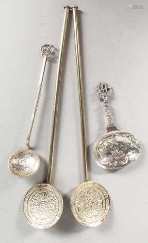 A PAIR OF STERLING SILVER GILT SPOONS, a caddy spoon and a coin spoon (4).