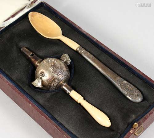 A VICTORIAN BABIES SILVER AND IVORY RATTLE, with whistle and a spoon in a fitted leather case.