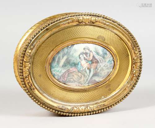 A GOOD FRENCH OVAL GILT METAL JEWELLERY BOX, the lid with young lovers. 6ins long.