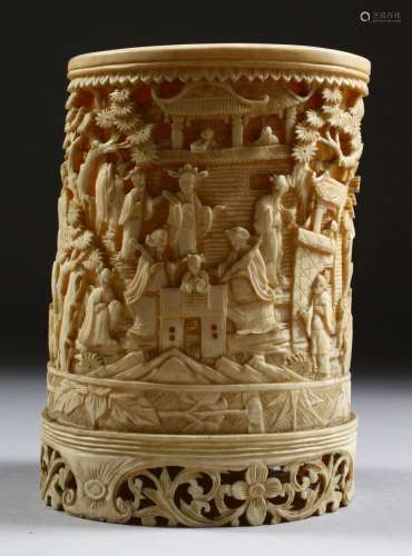 A GOOD CHINESE CANTON CARVED IVORY CYLINDRICAL BRUSH POT, carved in deep relief to depict scenes
