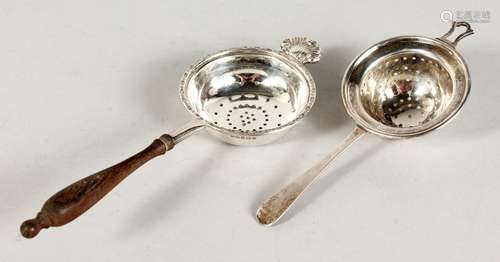 TWO SILVER TEA STRAINERS.