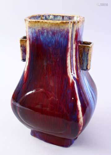 A GOOD CHINESE FLAMBE TWIN HANDLE PORCELAIN HU VASE, with a graduating flambe glaze and twin moulded