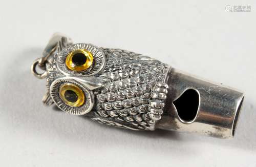 A NOVELTY SILVER OWL WHISTLE. 1.75ins long.