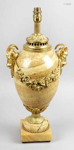 A fluorite lamp base of ovoid form with gilt metal mounts and twin goat head carry handles,