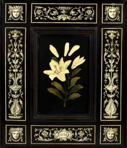 A 19th century pietra dura panel inlaid in a variety of mixed hardstones and depicting a lily