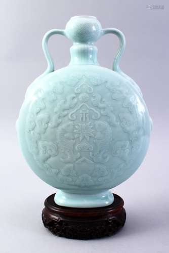 A GOOD CHINESE CELADON PORCELAIN MOONFLASK, the body decorated with scenes of archaic fish and cloud