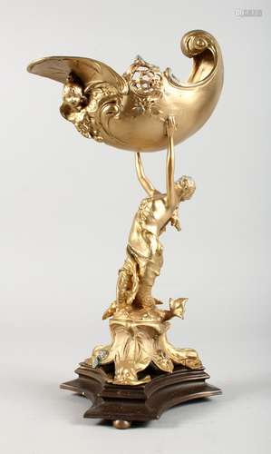 A GILT BRONZE TABLE CENTREPIECE, modelled as a lady holding a shell above her head. 16ins high.