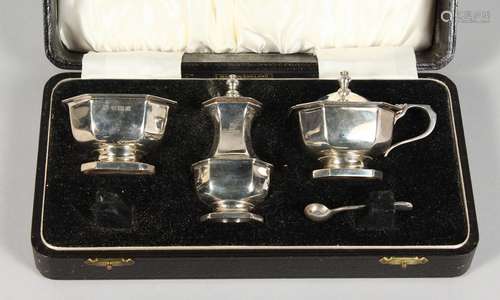 A THREE PIECE SILVER CRUET in a fitted case. Birmingham 1957.