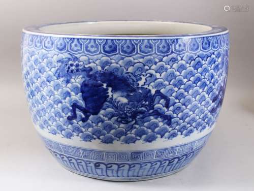 A GOOD JAPANESE MEIJI PERIOD BLUE & WHITE ARITA PORCELAIN JARDINIERE , decorated with scenes of