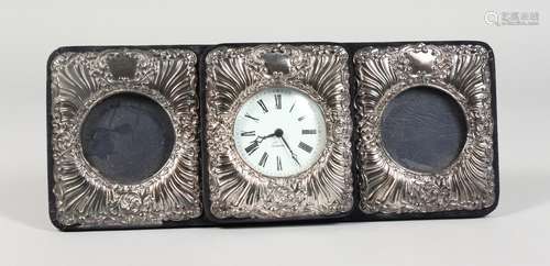 A SILVER CASED CLOCK and matching pair of photograph frames.