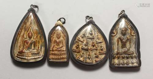 FOUR TIBETAN ICON STYLE METAL PENDANTS. 2ins, 2.5ins and 3ins.