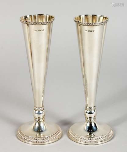 A PAIR OF FLUTED SILVER VASES, with circular bases. 6.5ins high. Birmingham 1903.