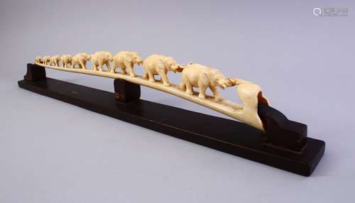 A JAPANESE MEIJI PERIOD CARVED IVORY ELEPHANT BRIDGE GROUP, carved in one piece to depict a herd