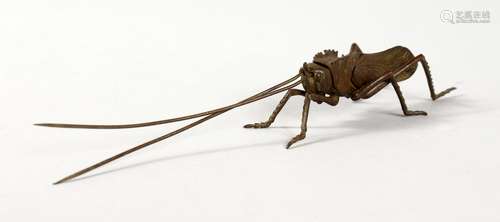 A SMALL JAPANESE BRONZE ARTICULATED LOCUST. 5.75ins long.