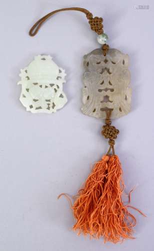 TWO CHINESE CARVED JADE / HARDSTONE PENDANTS, one depicting chilong with silk tie, 6cm, the other of