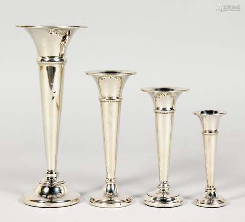 FOUR SMALL TRUMPET VASES.