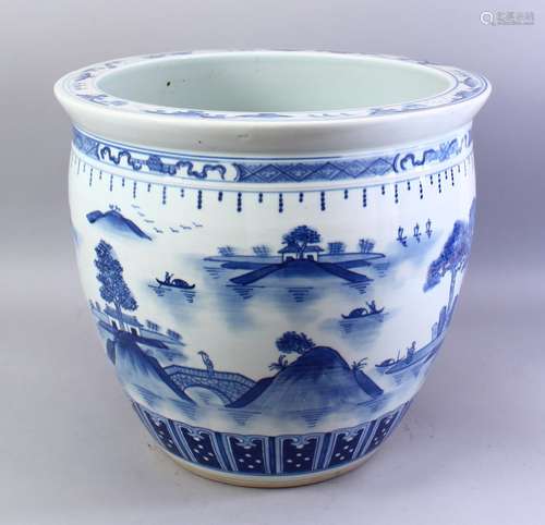 A LARGE CHINESE BLUE & WHITE PORCELAIN JARDINIERE, decorated with scenes of native landscape scenes,