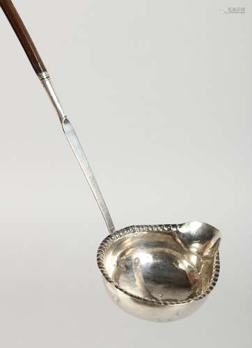 A SILVER TODDY LADLE.