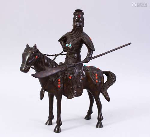 A GOOD 19TH / 20TH CENTURY CHINESE BRONZE FIGURE OF A GENERAL UPON HORSEBACK, decorated with inilaid