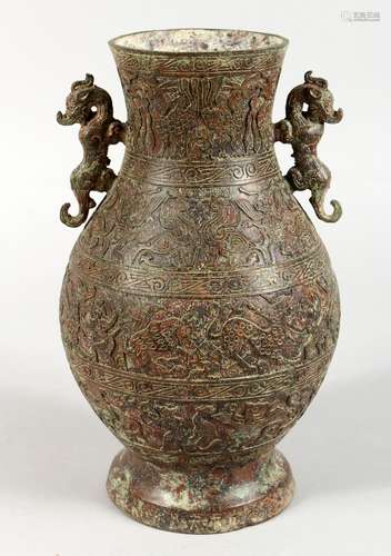 A CHINESE BRONZE ARCHAIC STYLE VASE, with kylin handles. 10.5ins high.