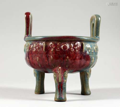 A CHINESE PURPLE SPLASH TWIN-HANDLED POTTERY CENSER ON THREE LEGS. 6ins wide.