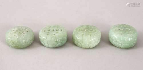 FOUR 19TH / 20TH CENTURY CHINESE CARVED CELADON JADE PENDANTS, all of cylindrical form and pierced,