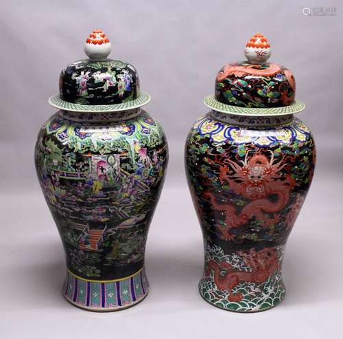 A LARGE MATCHED PAIR OF CHINESE FAMILLE NOIR FLOOR STANDING URN AND COVERS. 46ins high.