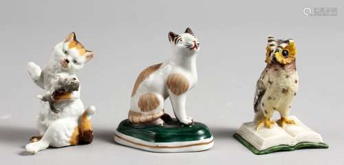 A SMALL PORCELAIN SEATED CAT, in the style of Chelsea, a cat and kitten, and a wise owl (3). 2.5