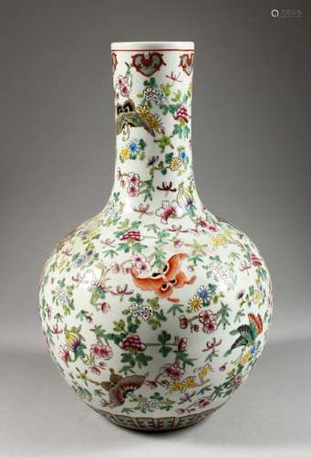 A LARGE CHINESE PORCELAIN BOTTLE VASE, painted with butterflies. 14.75ins high.